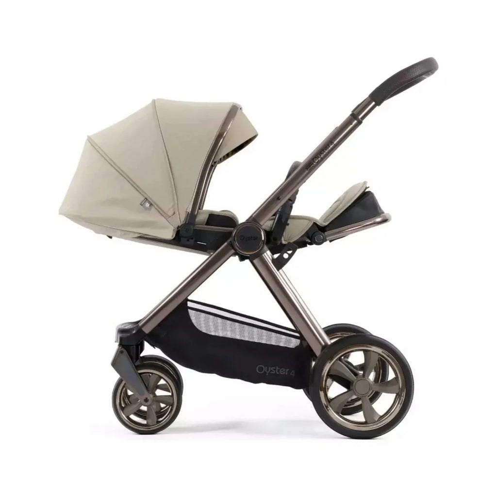 Single stroller with buttermilk canopy and black chassis, three-quarter angle