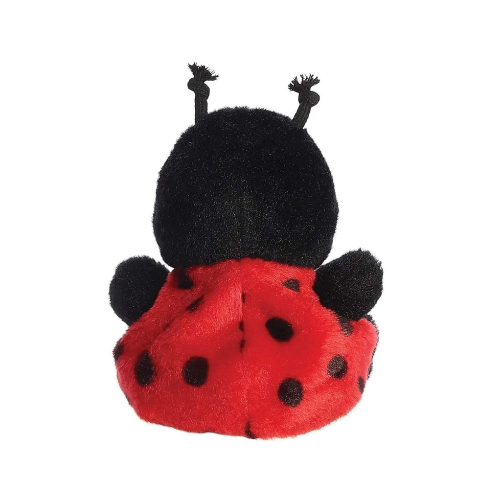 Ladybird plush toy from behind, black top and red underside with black spots