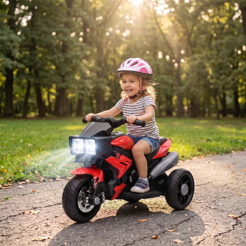 Kids red 3-wheel electric ride-on motorcycle toy with glowing front lights and wide tires
