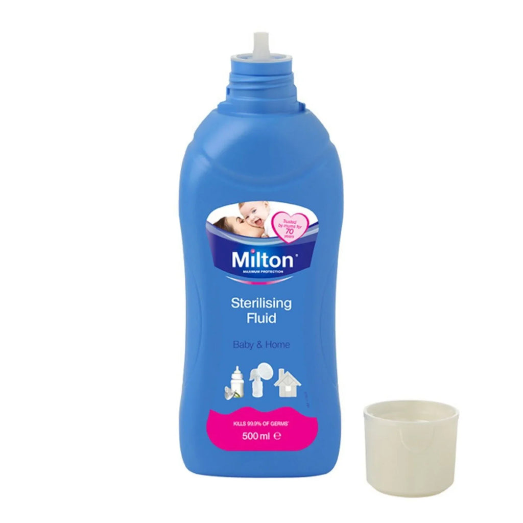 Milton sterilising fluid 500ml bottle with small measuring cup beside it