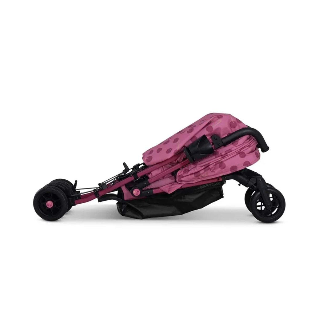 Cherry pink patterned stroller side view with reclined canopy and footrest