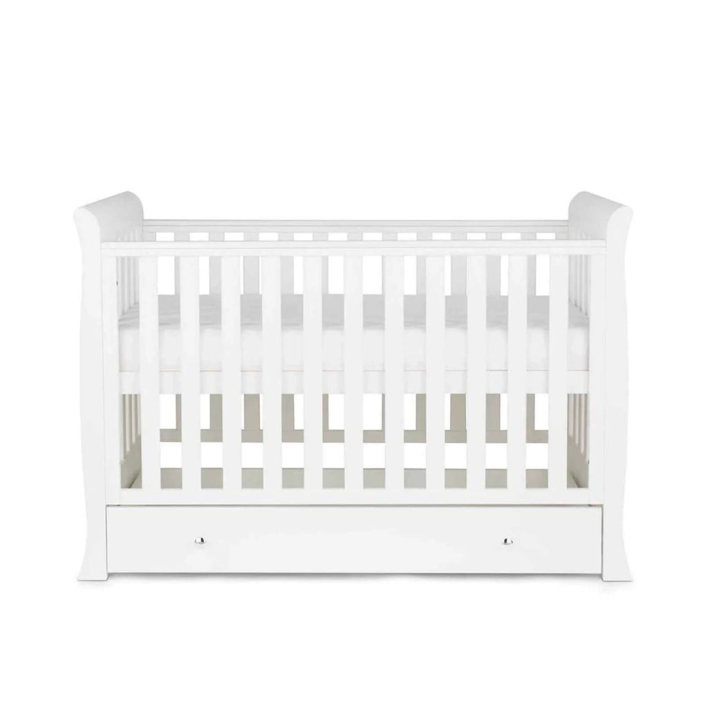White mini cot bed with front drawer and open rails, viewed straight-on on white background
