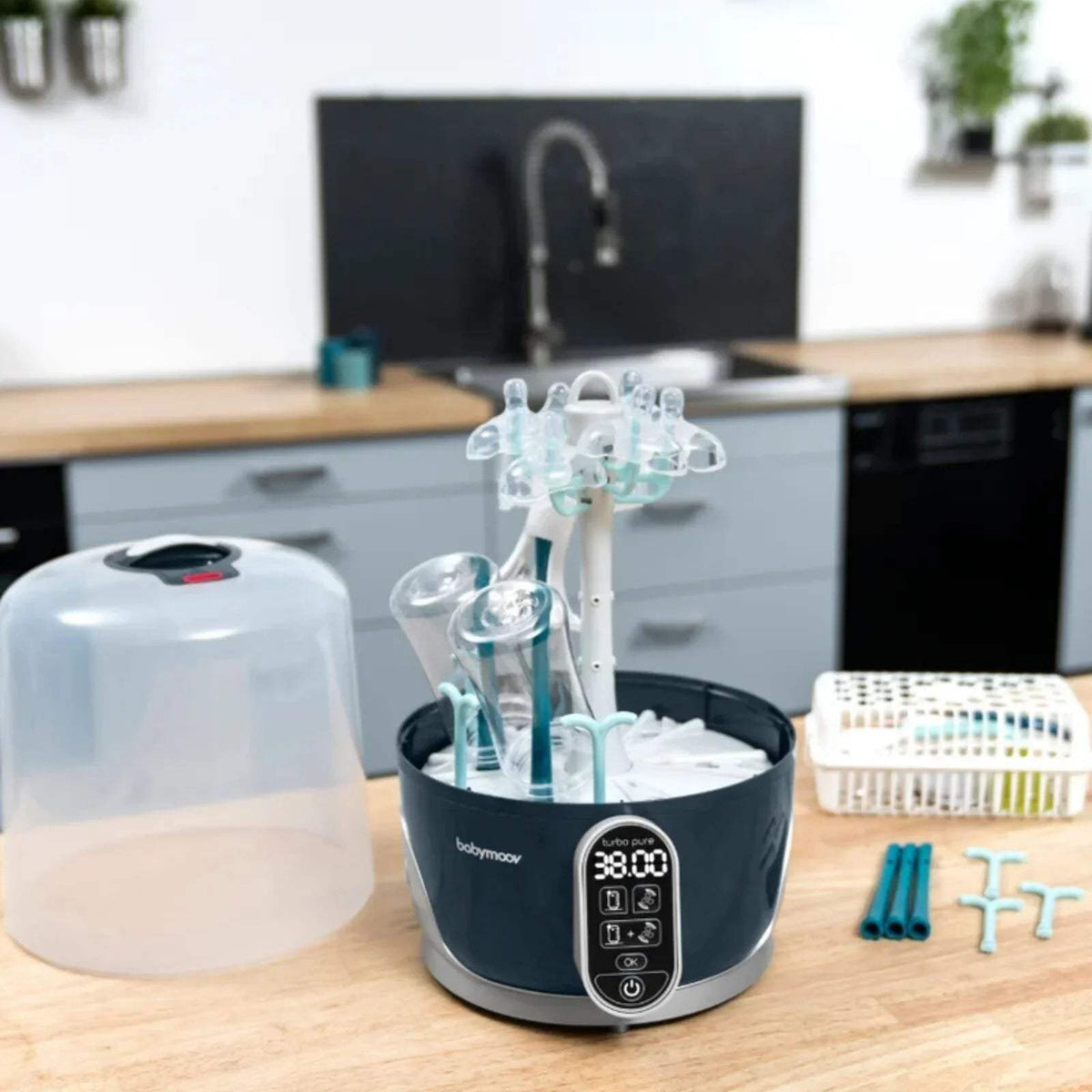 Babymoov Turbo Pure steriliser and dryer on base with bottle rack and control panel