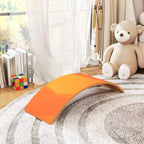 Orange curved wooden wobble balance board resting on a textured rug