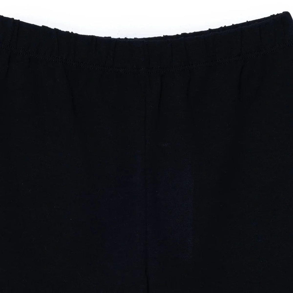 Black jersey baby shorts close-up of elastic waistband and front seam