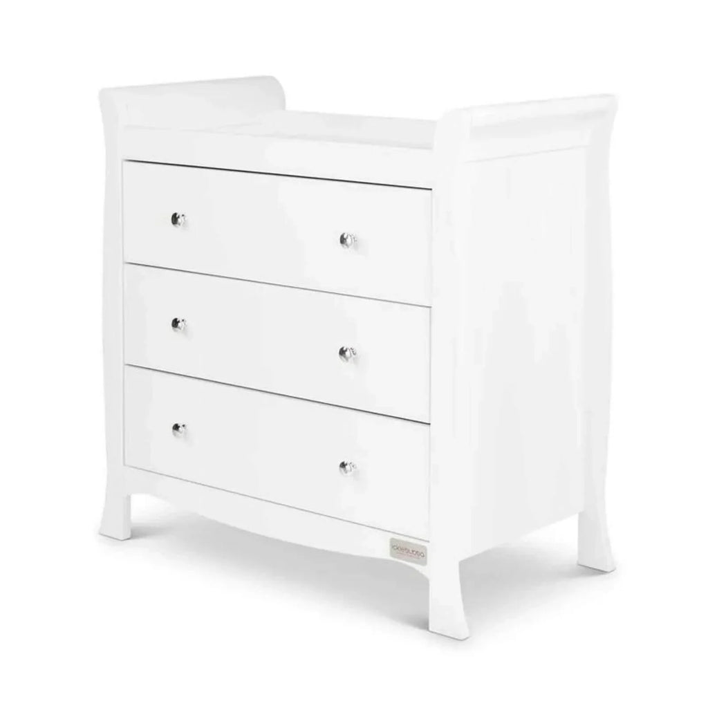 White child dresser with three drawers and round metal knobs, angled view.
