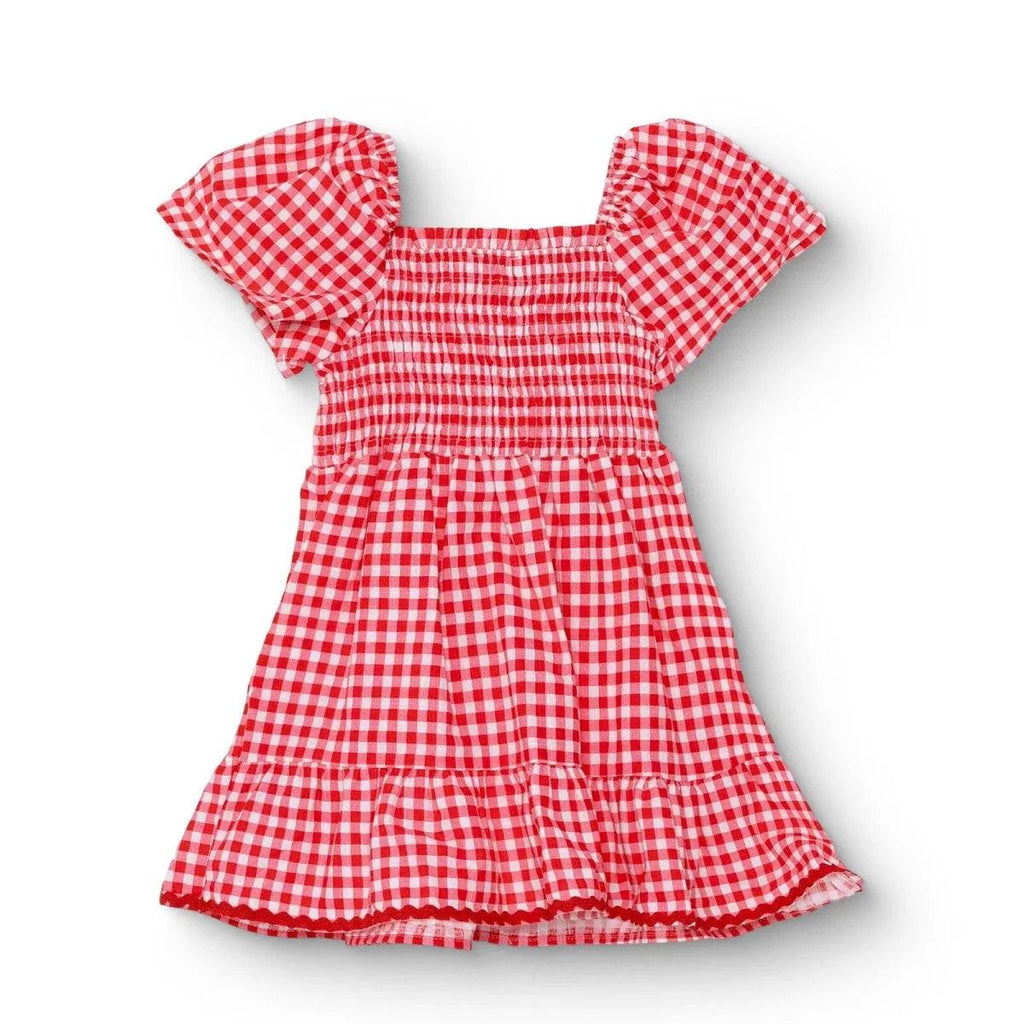 Pink gingham baby dress with shaped neckline, short puff sleeves, and tiered skirt ruffles