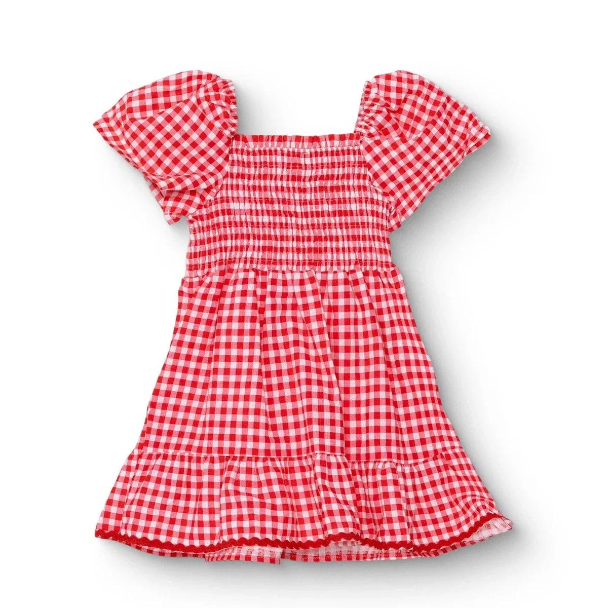 Pink gingham baby dress with shaped neckline, short puff sleeves, and tiered skirt ruffles
