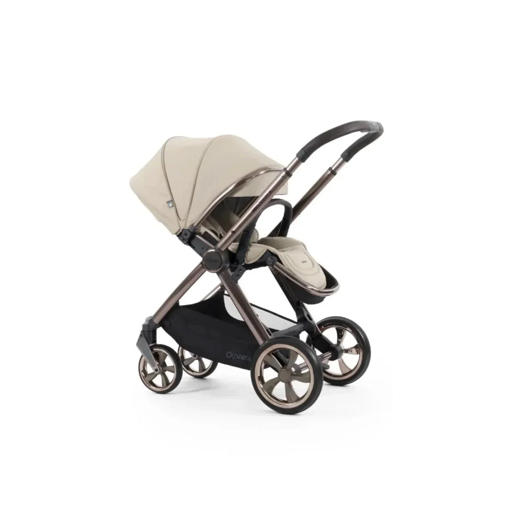 Single pushchair stroller in buttermilk with beige seat, black frame and handle, angled view