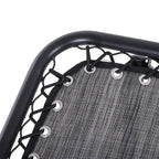 Light grey lounge chair seat with dark tube frame and bungee cord webbing