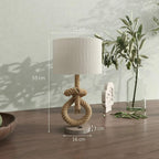 Cream lampshade hemp rope table lamp with circular weighted base, side view
