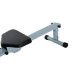 Rowing machine close-up of padded seat, support frame, and end roller feet in grey and black
