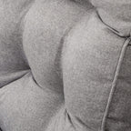 Close-up of grey upholstered outdoor cushion padding