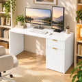 White computer desk with side cabinet drawer and gold handles supporting dual monitors