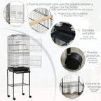 Black bird cage with wooden perches, slide-out dropping tray, and wheeled base