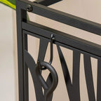 Black steel rack side hook detail with curved bar for hanging fireplace tools