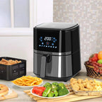 Black air fryer on countertop with LED control panel and front basket handle