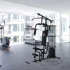 Black home gym weight station with stacked frames, pulleys, and dual handle grips