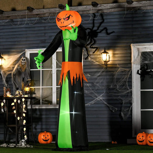 Tall inflatable pumpkin-ghost with built-in LED lights, black outfit and green hands, outdoor display