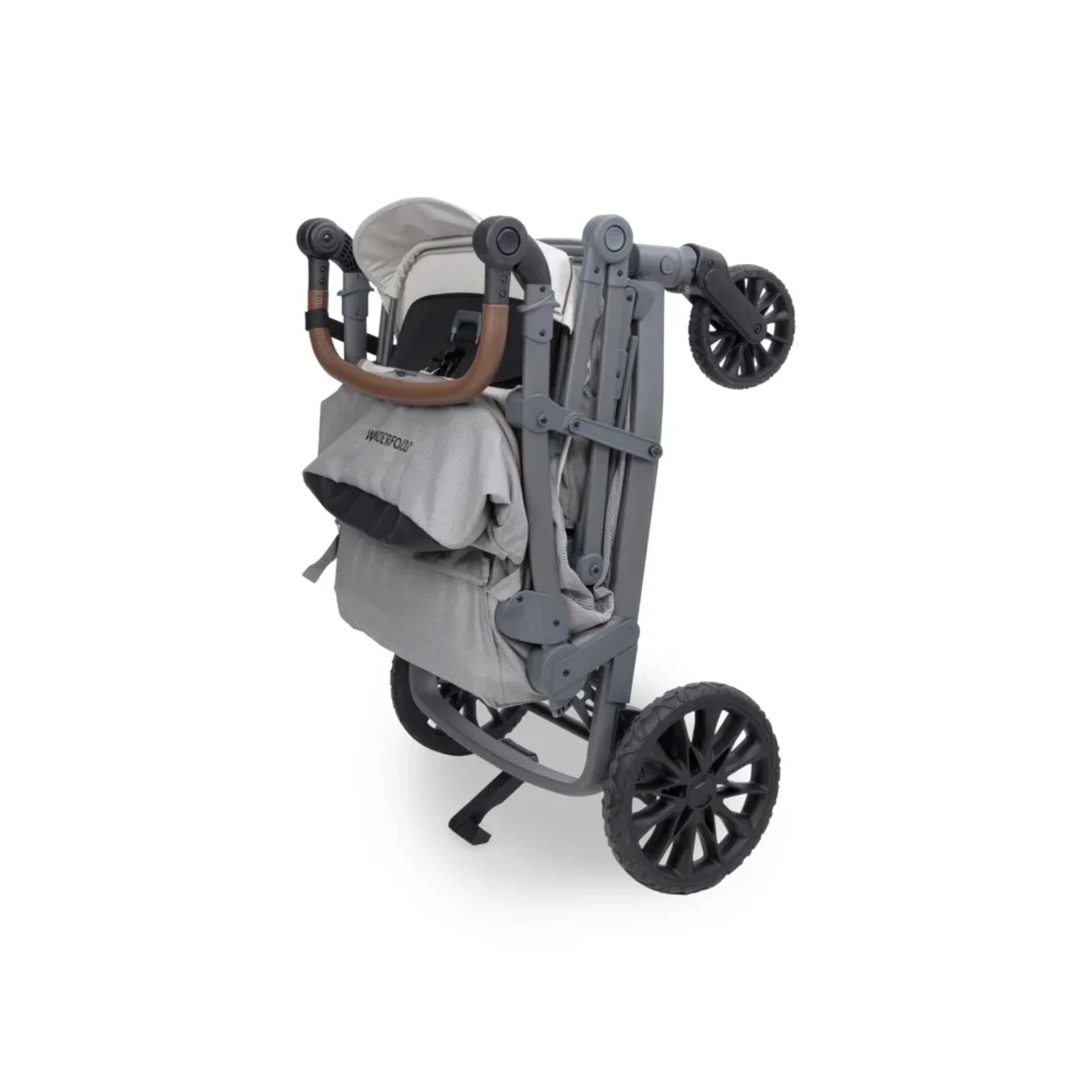 Grey stroller wagon side view with canopy, harness straps, and large wheels