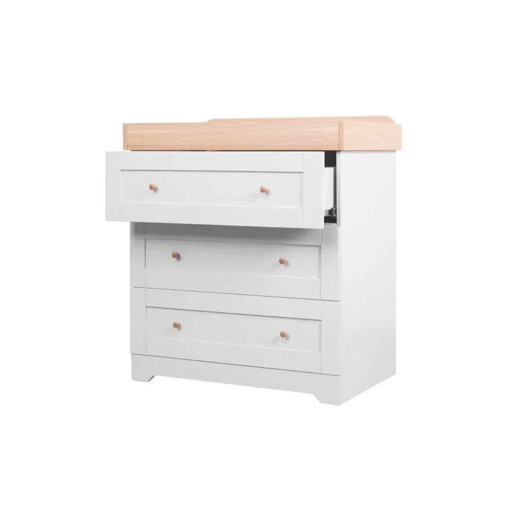 Baby chest changer with open changing area and light wood top over white drawers