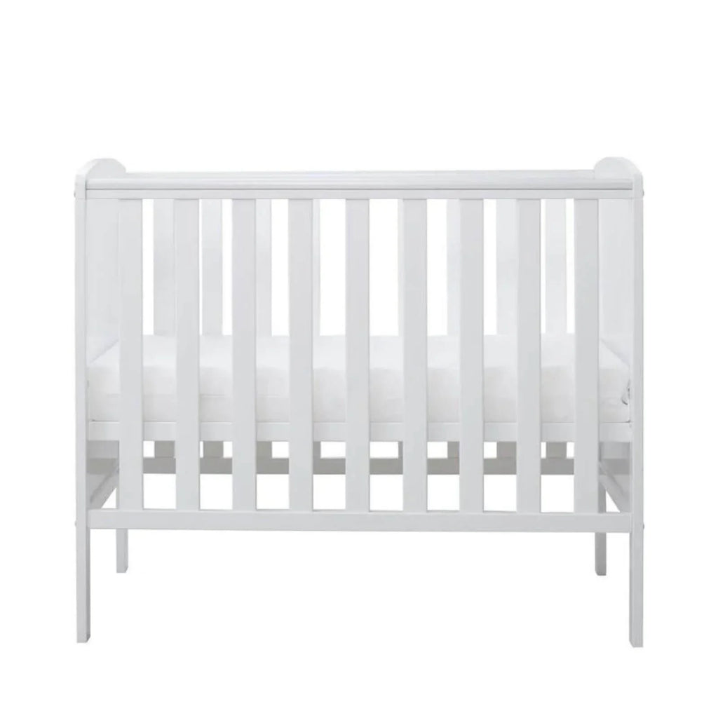 White cot with full-height slat panels and open front