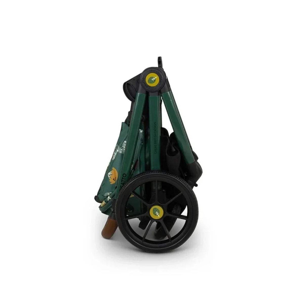 Green pushchair with black wheels and patterned seat fabric, rear wheel view