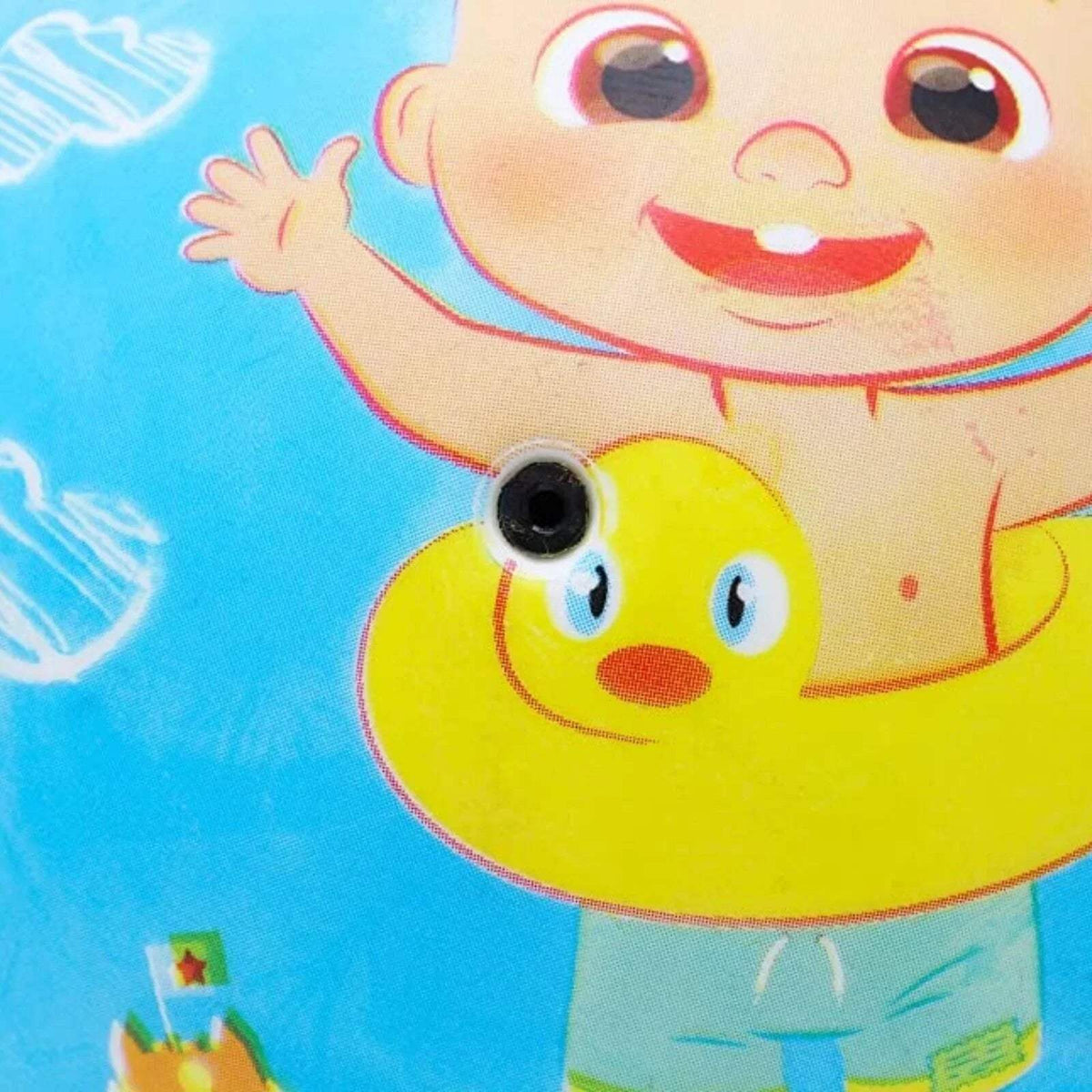 Close-up of inflatable ball with smiling character, yellow duck, and valve detail