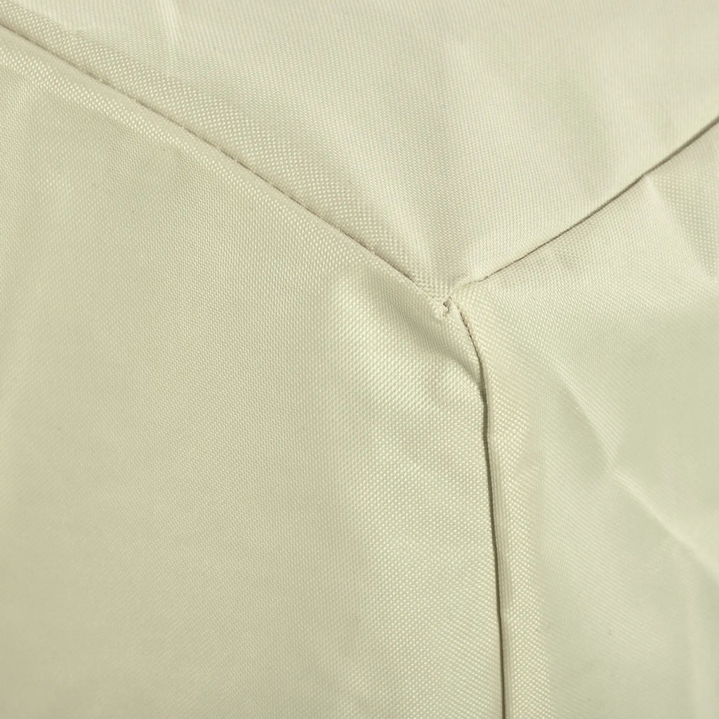 Close-up of beige chair cover fabric and stitched panel seams