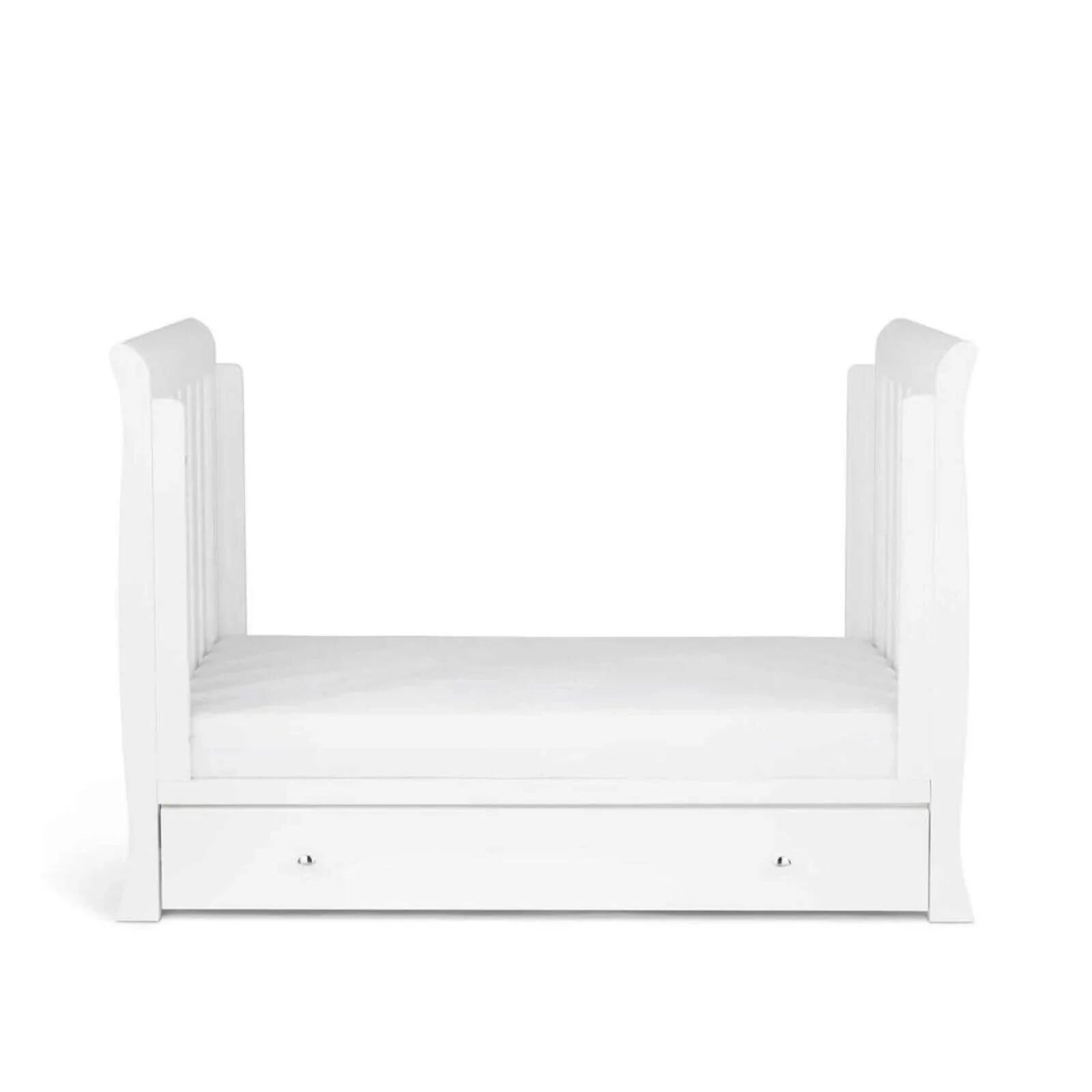 White mini cot with curved posts and a drawer under the mattress base