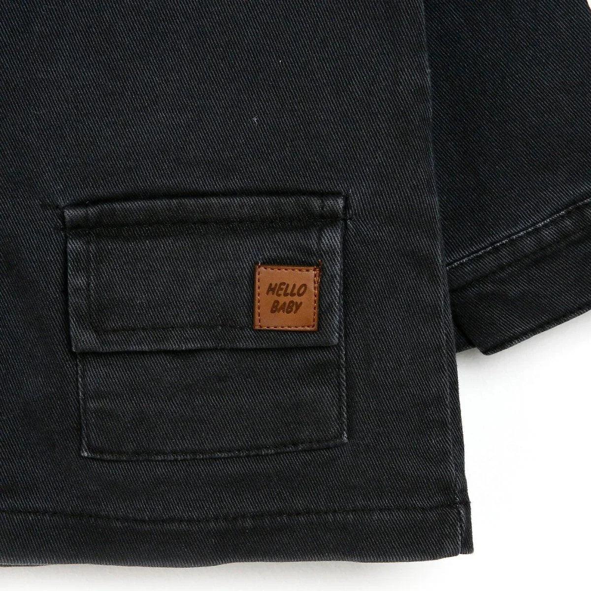 Dark anthracite baby jacket pocket with stitched label patch