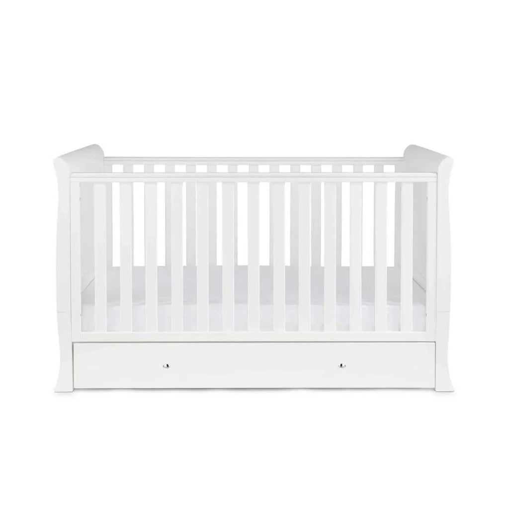 White cot bed with vertical slats and front drawer storage