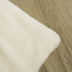 Beige plush cushion for a dog crate end table, soft fabric cover.
