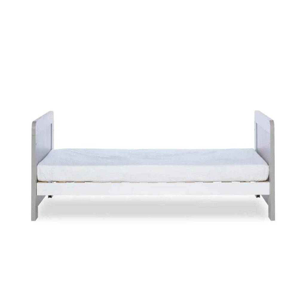 Cot bed with white padded base and ash grey ends; mattress not included.