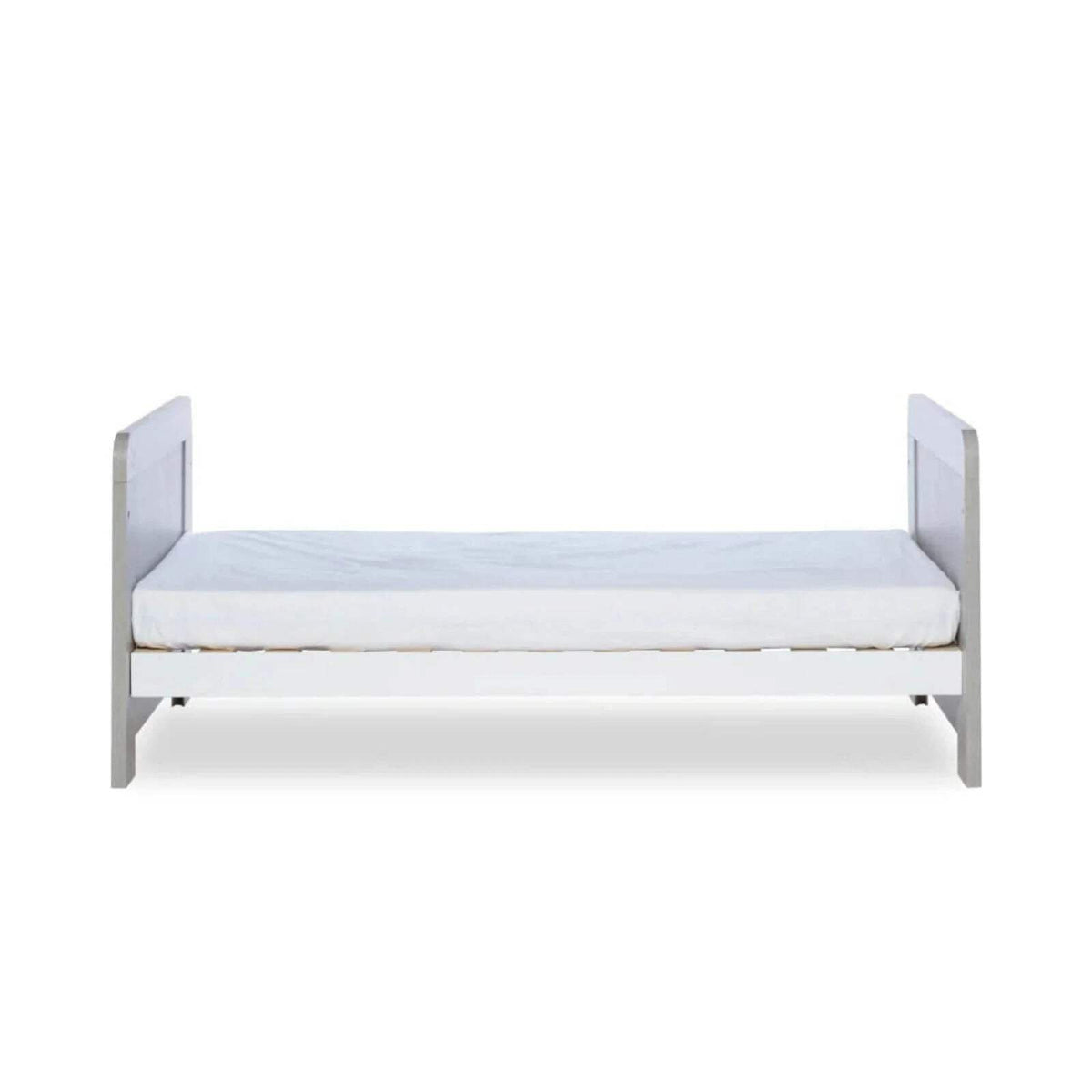Ash grey cot bed with light mattress base and white protective side rails
