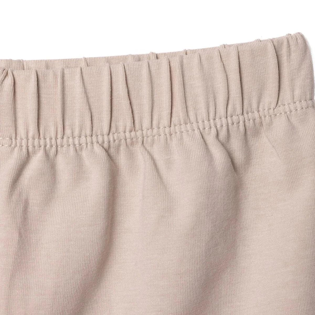 Mink jersey baby shorts waistband close-up with gathered elastic