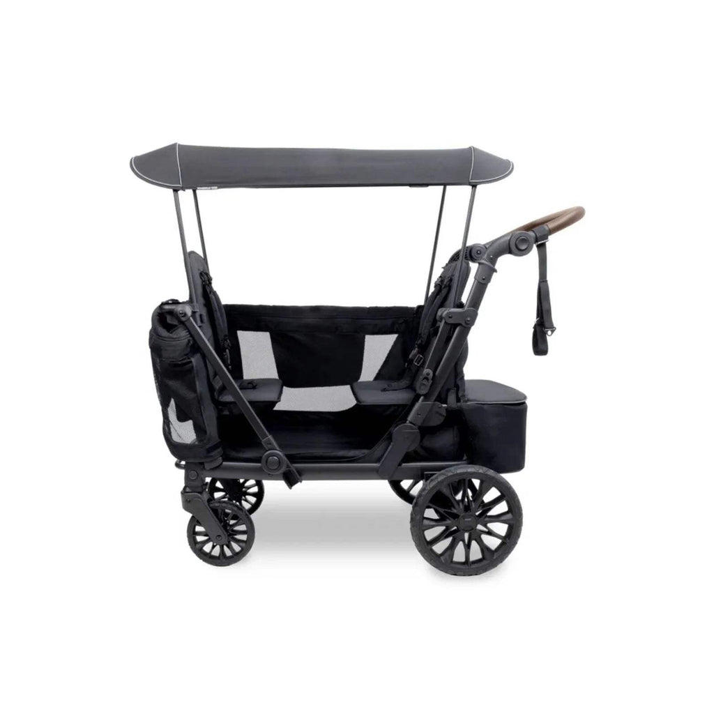 Black quad stroller wagon side view with canopy, padded seats, and large spoked wheels