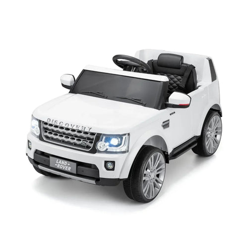 White 12V ride-on Land Rover Discovery with black seat, steering wheel, and front headlights
