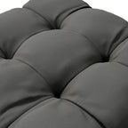 Charcoal gray quilted seat cushion close-up, tufted padded panels with stitching
