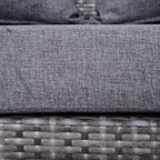 Grey upholstered seat cushion on grey PE rattan wicker base with stitched fabric surface