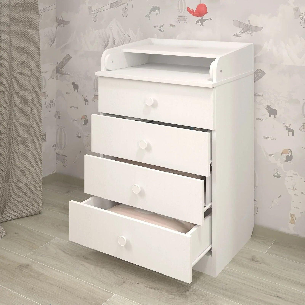 White changing dresser with 4 drawer fronts and wide changing pad