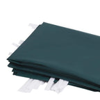 Stack of dark green replacement gazebo side panels in folded fabric