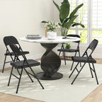 Set of four black folding chairs for dining, curved padded backs and seats