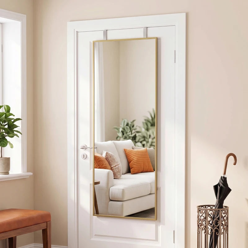 Gold-tone rectangular mirror mounted in door frame, full-length view.