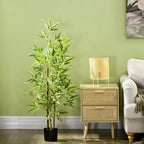 Artificial bamboo plant in black pot with green stalks and leaves for home decor