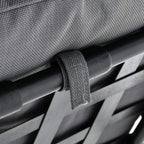 Close-up of grey fabric strap securing on metal support bar for porch swing