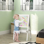 White standing art easel with double boards showing colorful crayon drawings