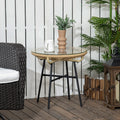 Round rattan side table with clear tempered glass top and black metal legs