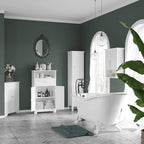 White bathroom storage cabinet with double doors in a bathroom setting