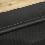 Black textured gym mat surface with light wood edge